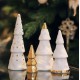 Quatre sapins en porcelaine blanche et argent